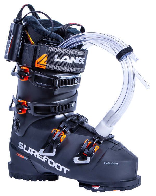 The Surefoot LX 120 HV Shell is black with orange accents on the buckles. There are four buckles, and one power strap. There are tubes out of the liner and a heater attached to the strap.